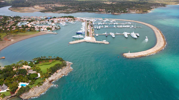 Casa de Campo Marina near Dreams La Romana Resort & Spa with luxury yachts and waterfront marina views