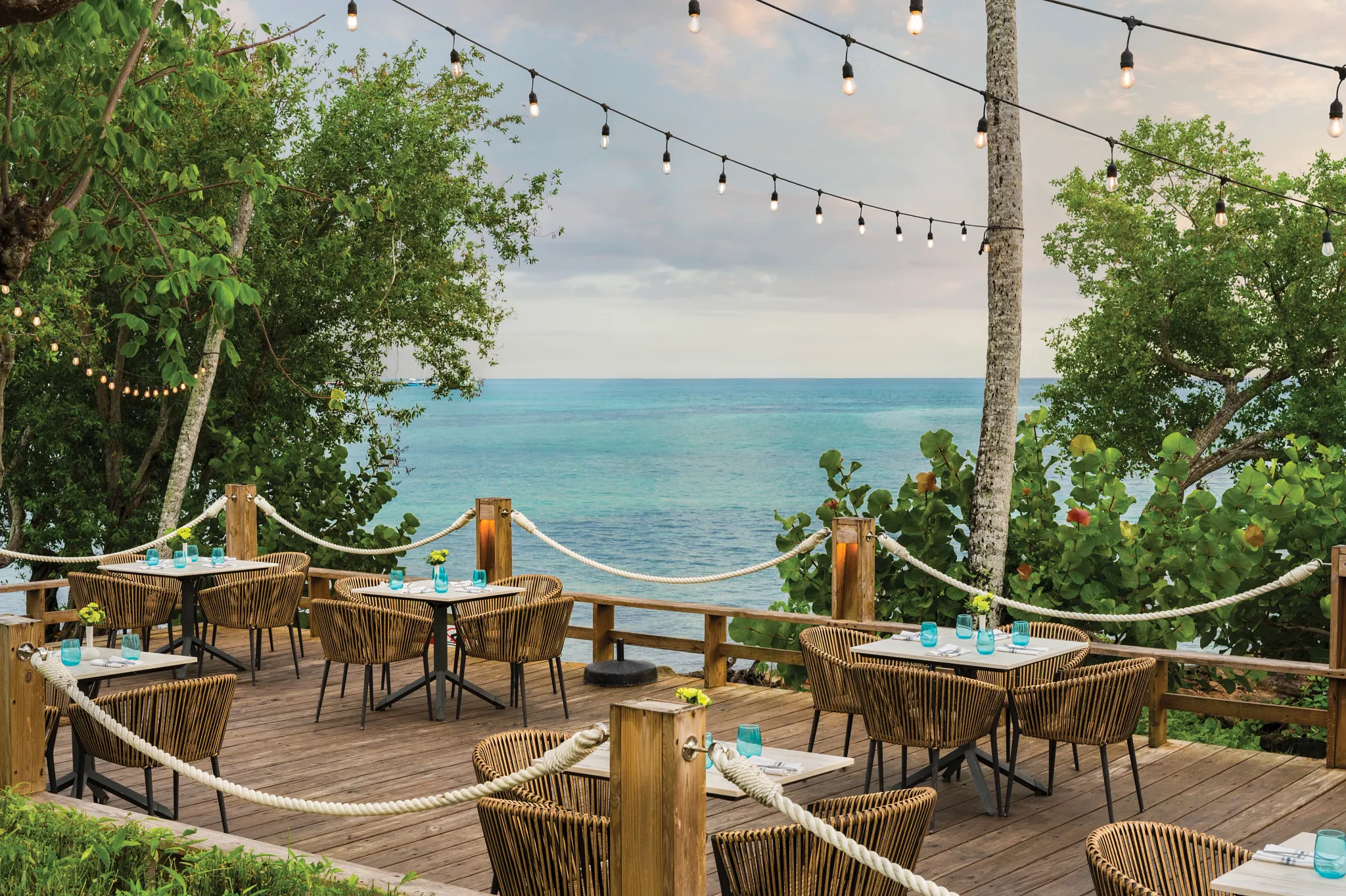 Coastal Grill restaurant at Dreams La Romana Resort & Spa featuring open-air dining, grilled specialties, and an elegant Caribbean-inspired atmosphere.