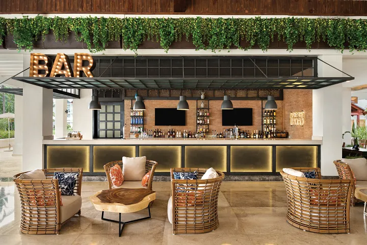 Preferred Club Lounge at Dreams La Romana Resort & Spa featuring elegant seating areas, premium beverages, and an exclusive upscale ambiance.