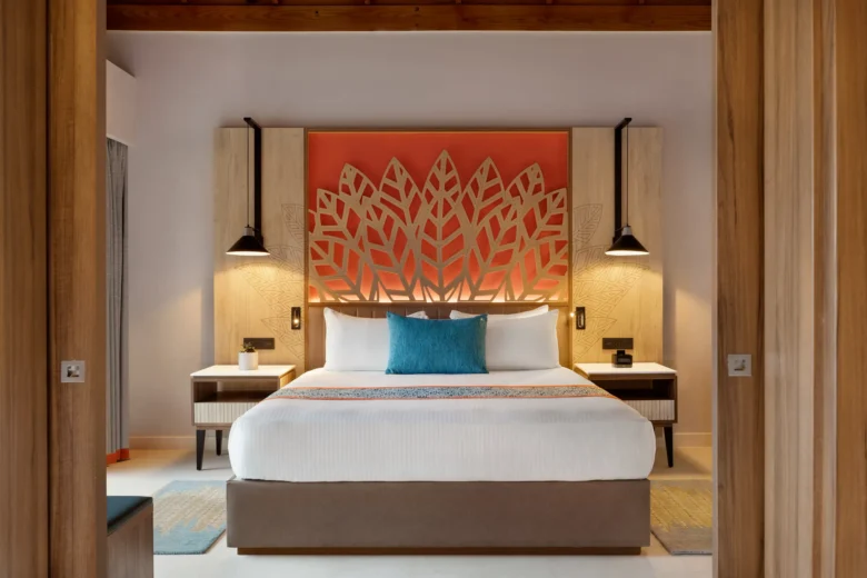 Preferred Club Suite Ocean Front with king bed and private furnished terrace at Dreams La Romana Resort & Spa.