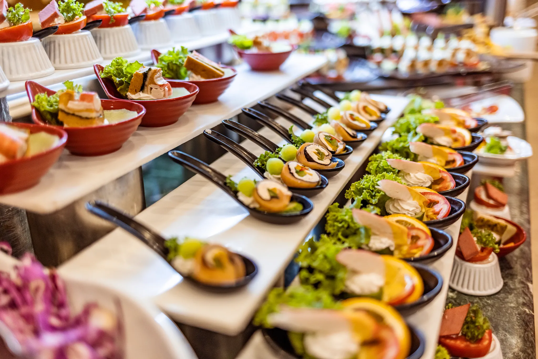 Spices Market restaurant at Dreams La Romana Resort & Spa featuring international buffet stations, modern décor, and a vibrant dining atmosphere.
